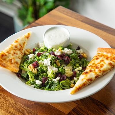 Chopped Kale Salad served with cheesy bread and buttermilk ranch on the side.
