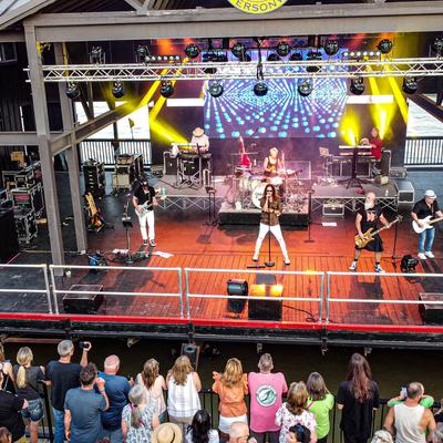 A band performing on the river stage