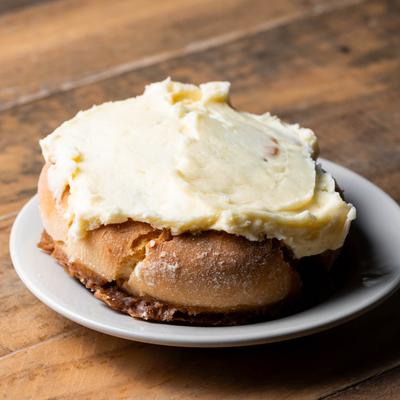 Cinnamon roll with cream cheese frosting.