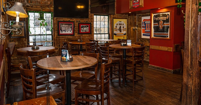 Interior, seating area with bar tables and stools