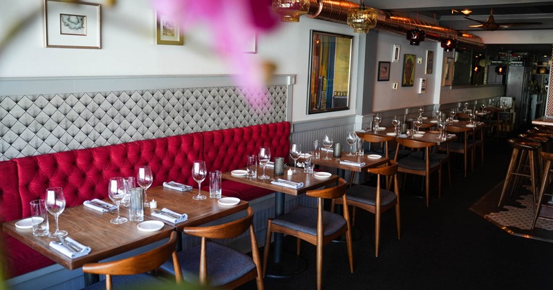 Interior, dining tables and chairs, long wall bench seating