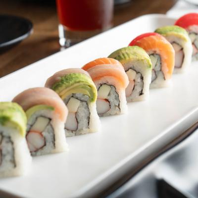 Rainbow Roll topped with avocado and a variety of fish.