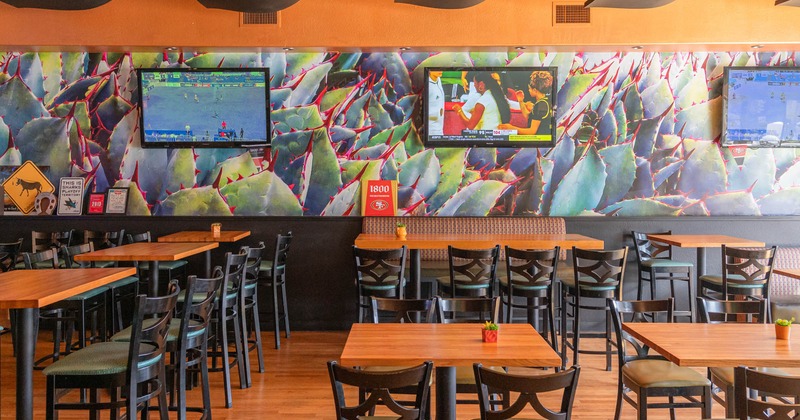 Interior, seating area, high and regular seating tables, high banquette bench with table