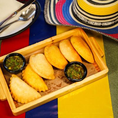 Cheese empanadas, with salsa verde.