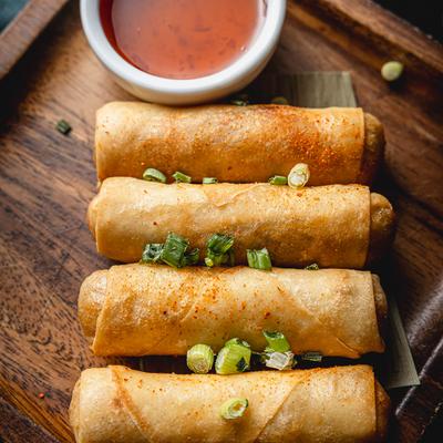 Spring rolls on serving board