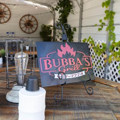 Restaurant's sugn placed at the outdoor table.