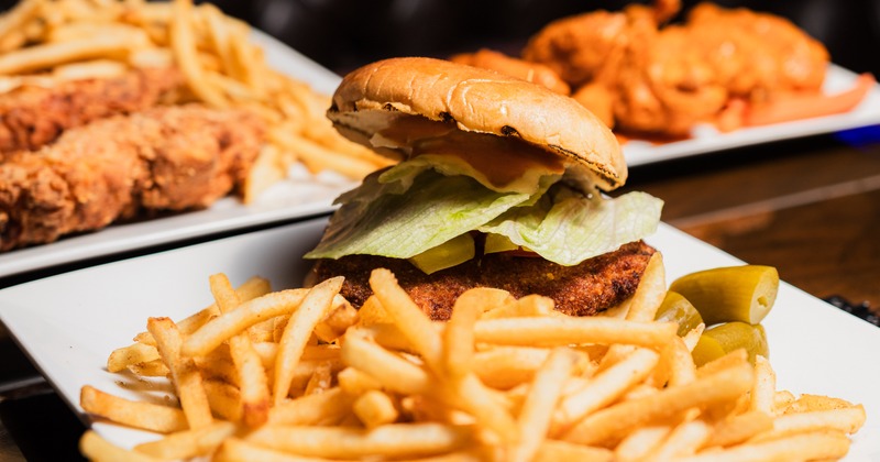 Sandwich with chicken and a side of fries