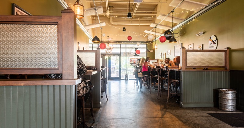 Interior, buttoned brown leather seating, tables and chairs