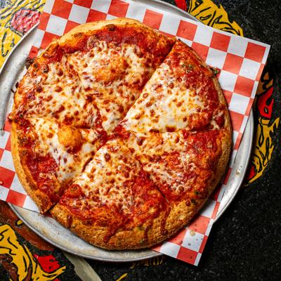 A whole cheese pizza sliced on a tray.