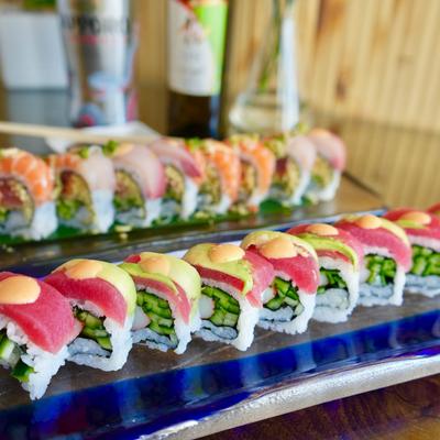 Sushi rolls with cucumber, tuna, and avocado.