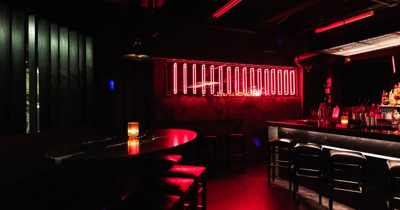 Dimly lit interior, seating and bar areas