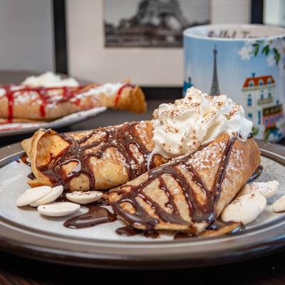 Crepe with chocolate sauce and whipped cream.