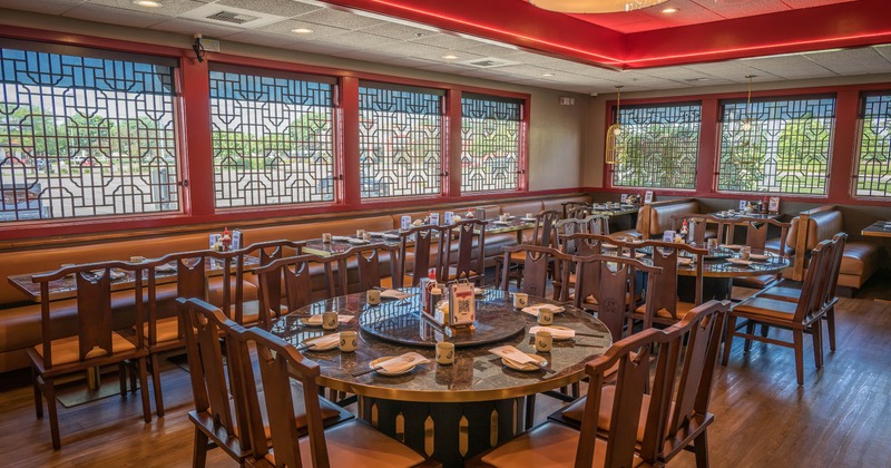 Interior seating area with booths, chairs and tables