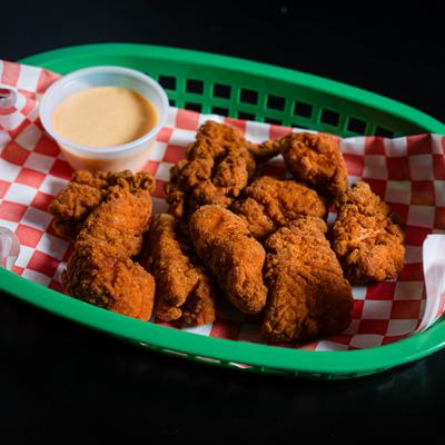Crispy chicken strips served with creamy sauce.