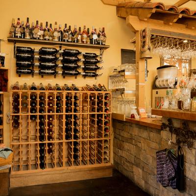 Shelves and counters stacked with bottles.
