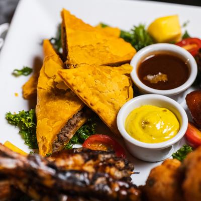 Shrimp, chicken, fried plantains, and dip.