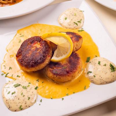Lump Crab Cakes with lobster sauce and lemon aioli