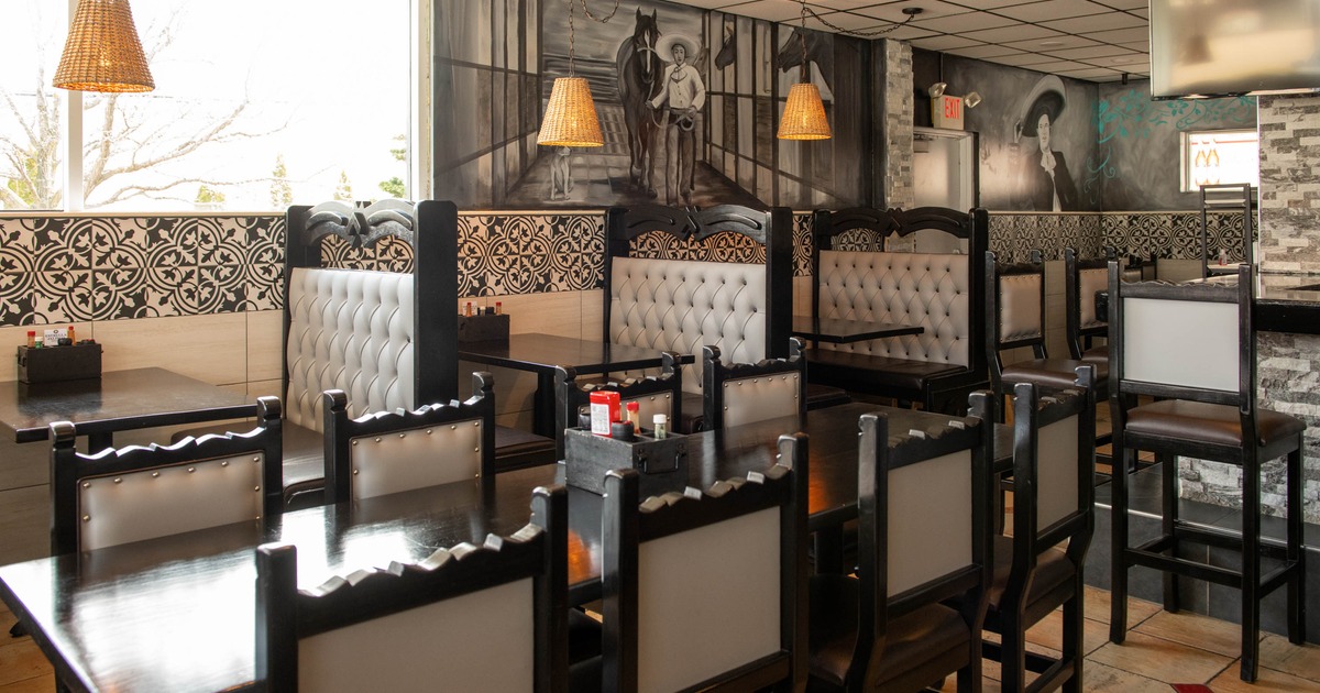 Interior seating area with double booths, chairs and tables