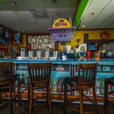 The bar counter and stools.