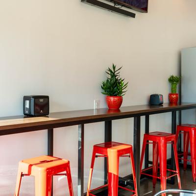 The wall counter and stools.