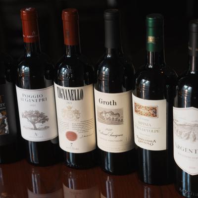 Various red wine bottles.