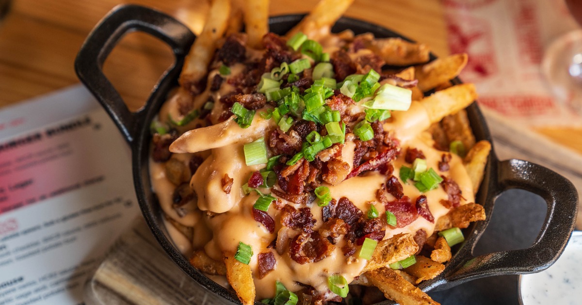 Trainwreck Fries with BBQ Short Rib served in a small skillet with handles