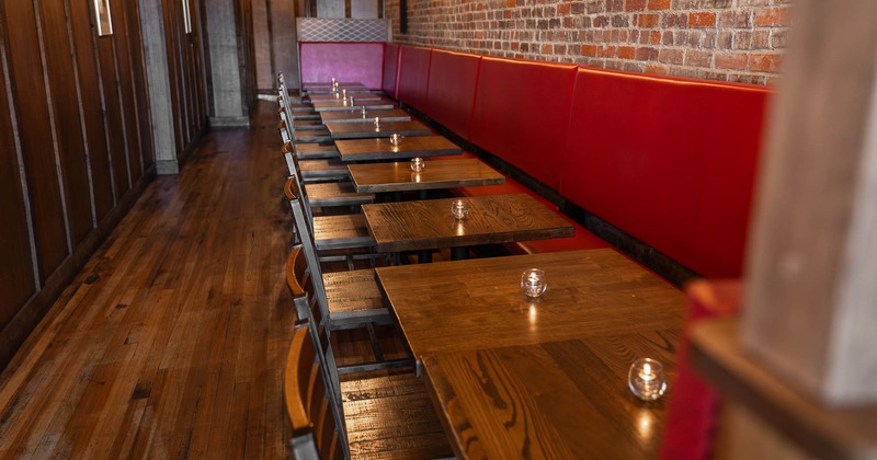 Interior, lined up tables and chairs, bench seating