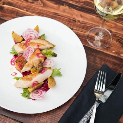 Salad with radishes, bread, and greens.