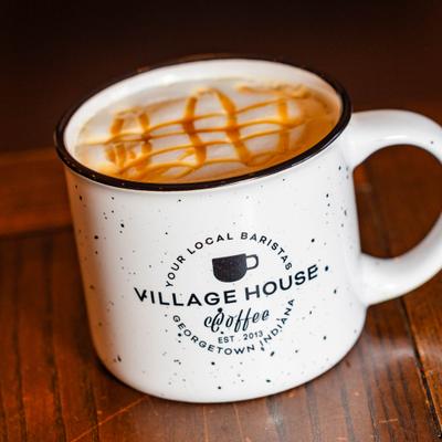 Caramel latte in a branded mug.