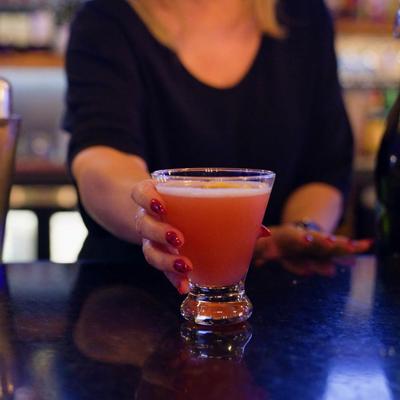 Bartender serving a drink.