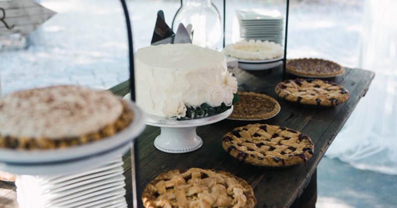 Wedding cake and pies on a table, close up
