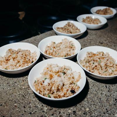 Bowls of fried rice on a counter.