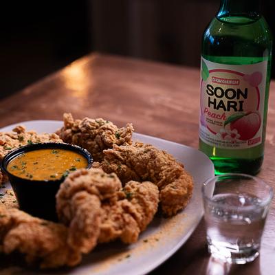 Cheese Monster Chicken, served with a drink.