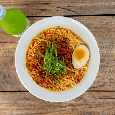 Spicy Tan-Tan Ramen with seasoned minced pork, scallions and half-flavored egg.