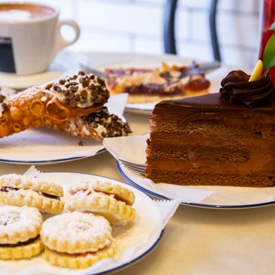 Chocolate cake slice with assorted pastries.