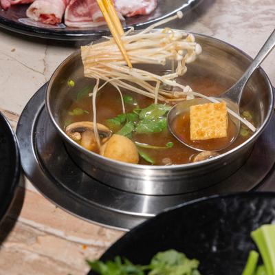 Soup with vegetables, mushrooms, and tofu.