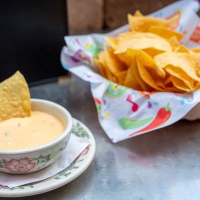 Queso Dip and tortilla chips.