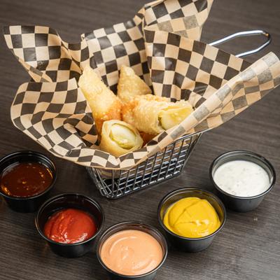 Fried Havarti Pickle Spears, with dipping sauccves.