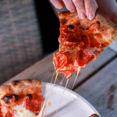 A slice of pepperoni pizza