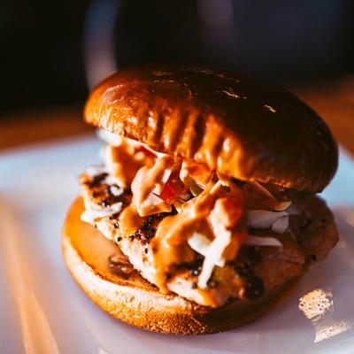 Salmon Burger with lettuce slaw and Nana's sauce.