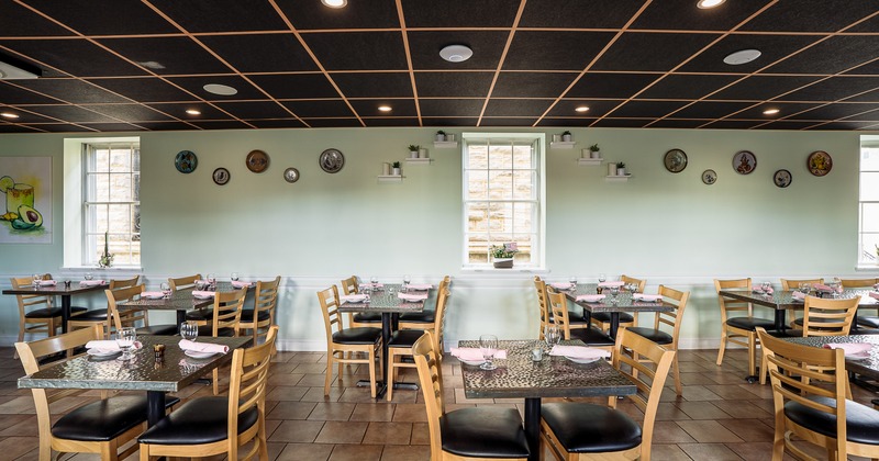 Spacious and cozy interior dining area with set dining tables