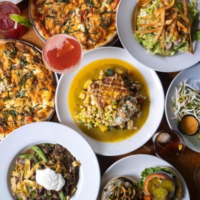 Assortment of dishes spread on a table.