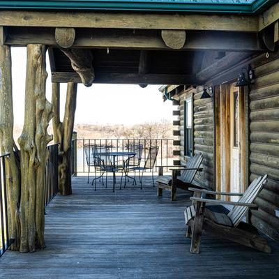 Cabin porch space with seating.