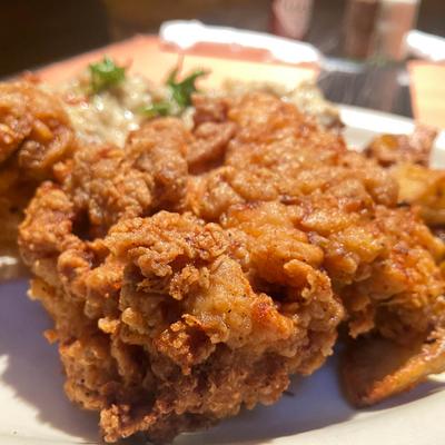 Fried chicken served with sides, close-up.