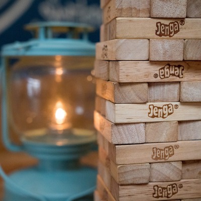 Tumbling tower with a candle lantern in the background.