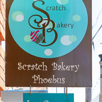 The bakery's hanging sign outside.