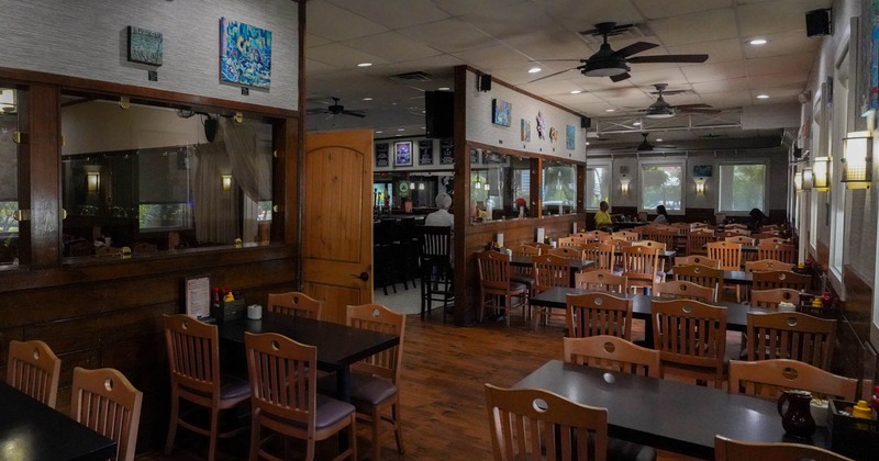 Interior, seating area with wooden tables and chairs