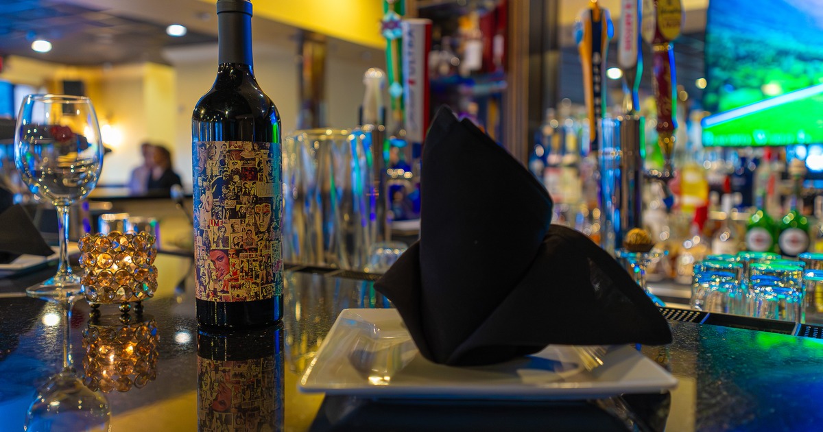 Diner plate, wine bottle, close up