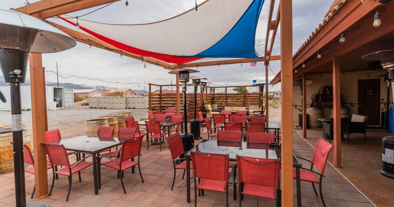 Exterior, red chairs and tables ready for guests