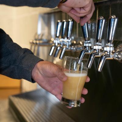 Pouring beer from the tap.